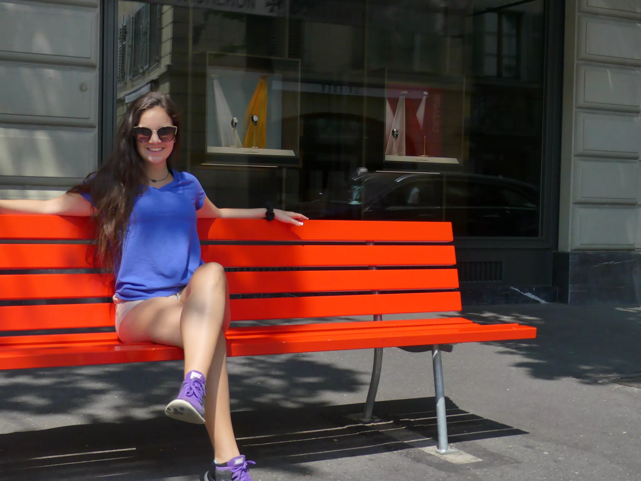 Teen in Blue on Red Bench