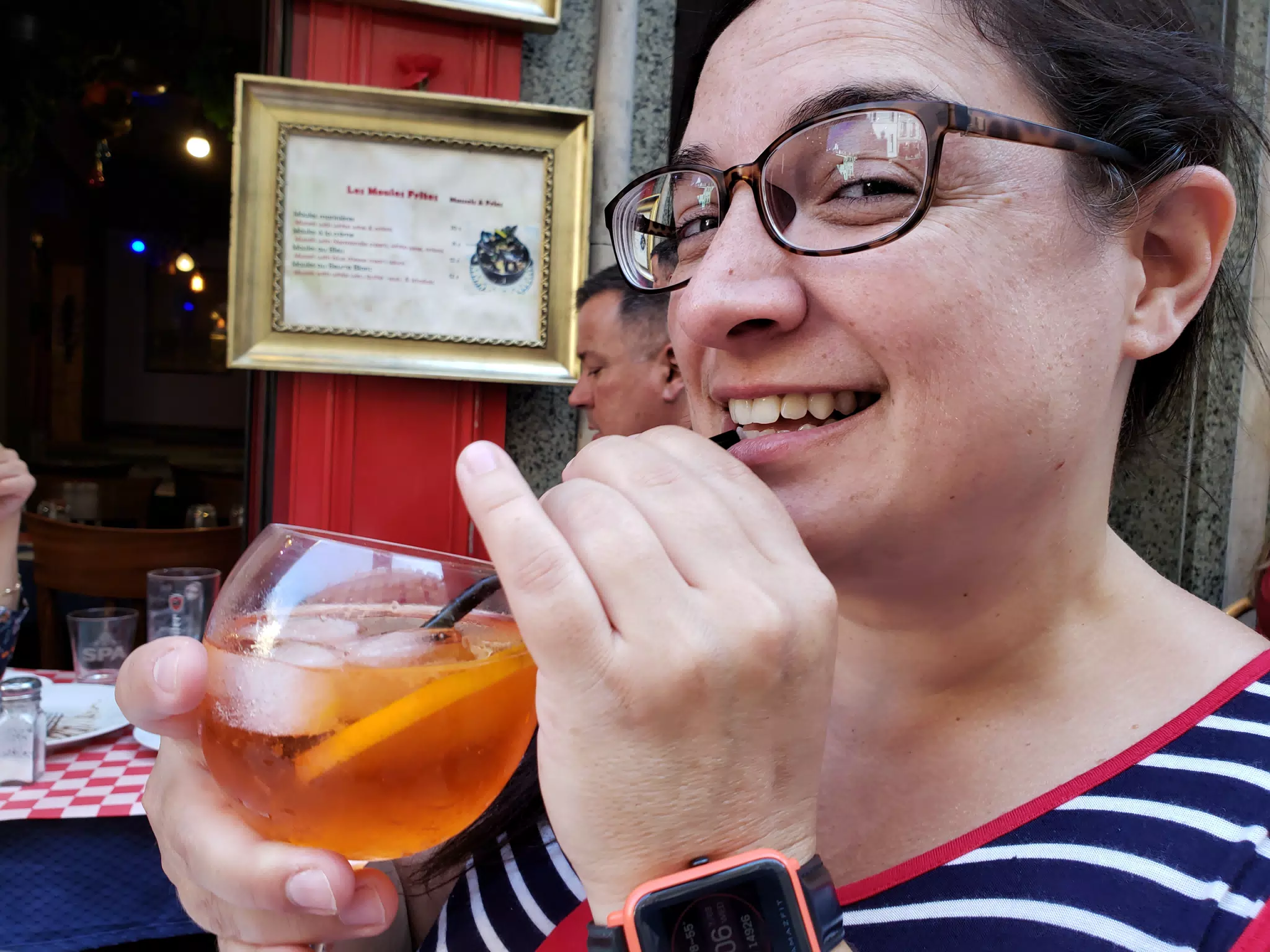 Dominica Drinking Aperol Spritz Cocktail in Paris