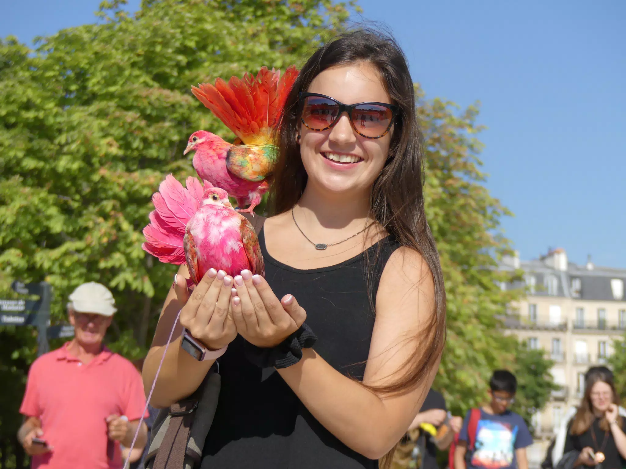 Emily with Bird in Park in Paris