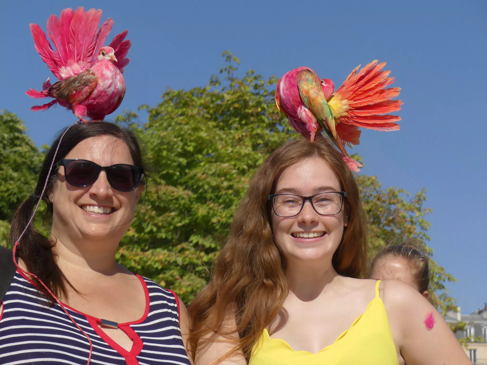 Dominica and Madeline in Paris with Birds on their Heads in the Park