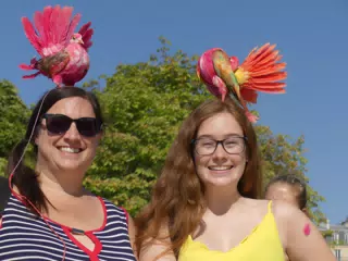 Dominica and Madeline in Paris with Birds on their Heads in the Park