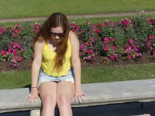 Madeline in Skirt on Bench in Paris