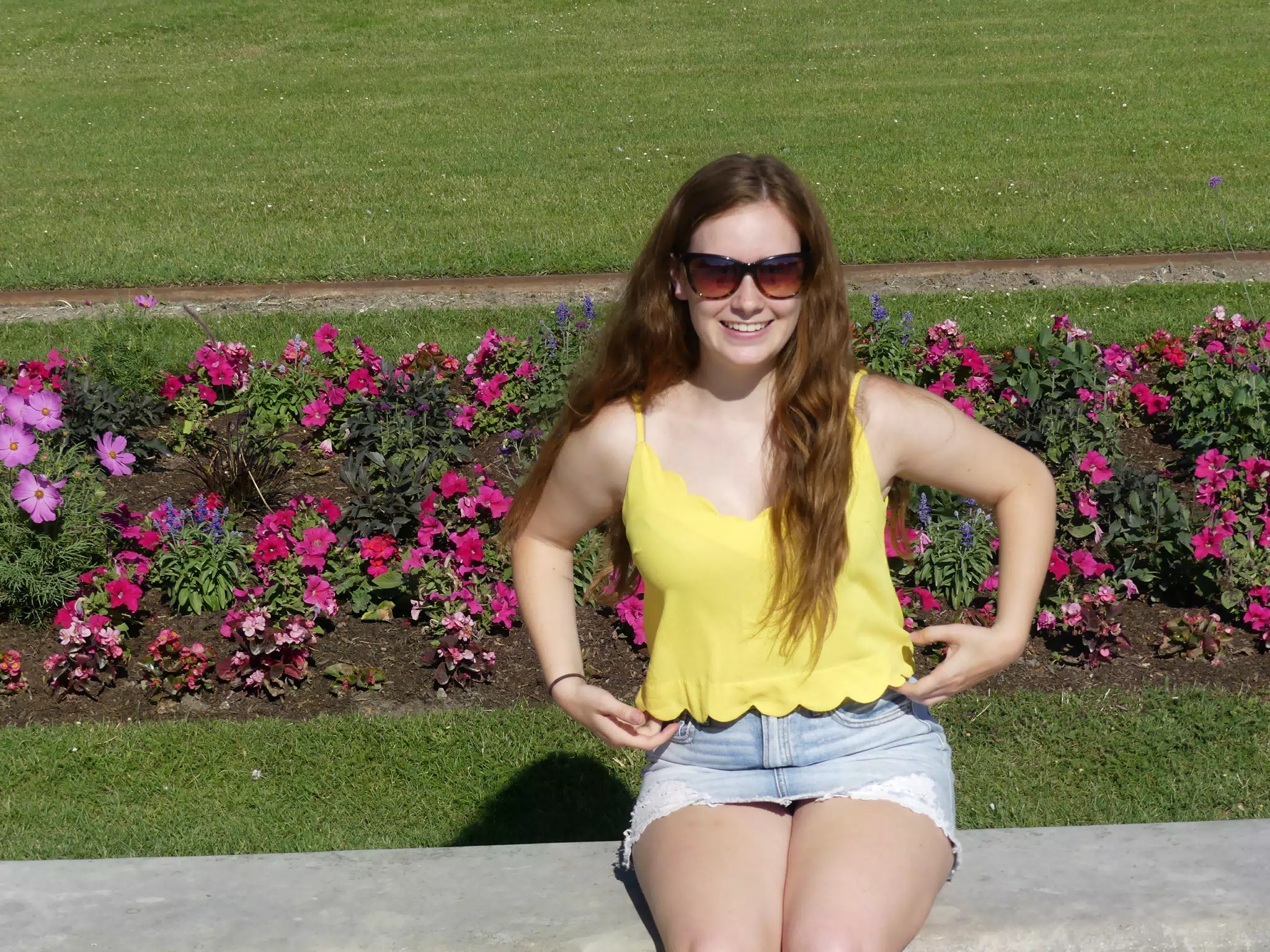 Madeline in Park in Paris in Denim Skirt
