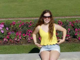 Madeline in Park in Paris in Denim Skirt