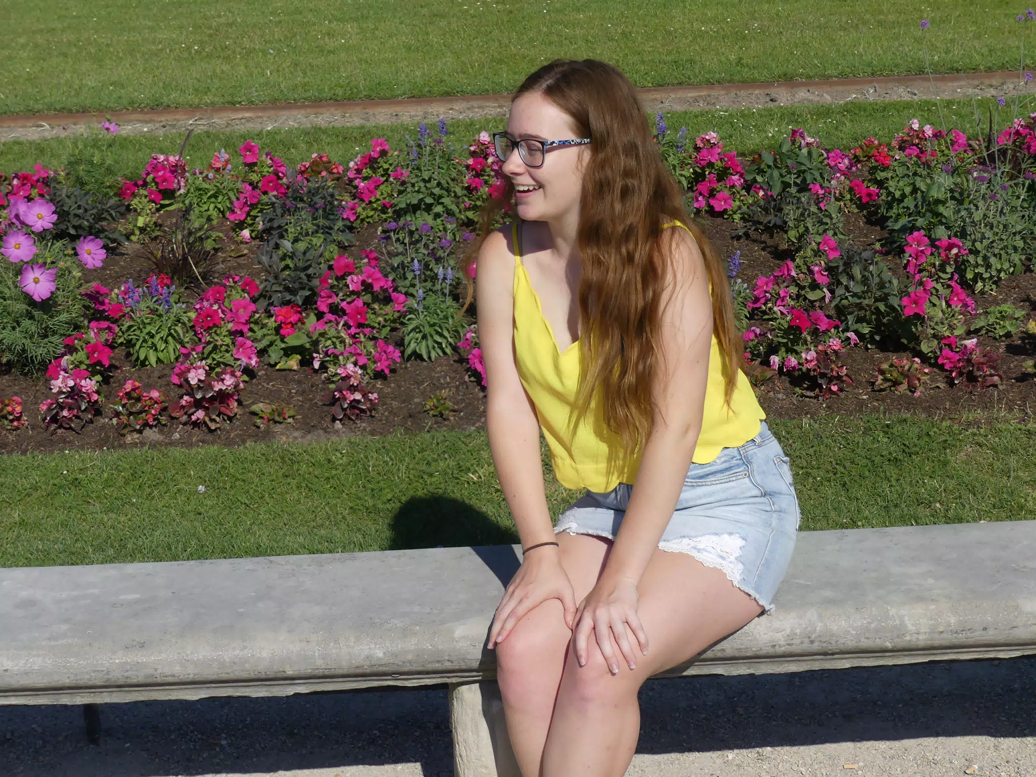 Madeline Laughing on Bench