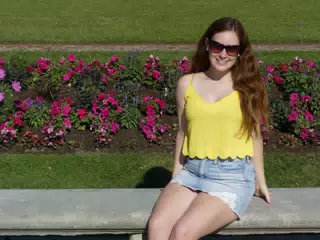 Smiling Teen in Yellow on Park Bench in Paris