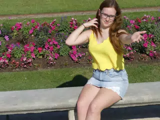 Madeline on Park Bench in Skirt
