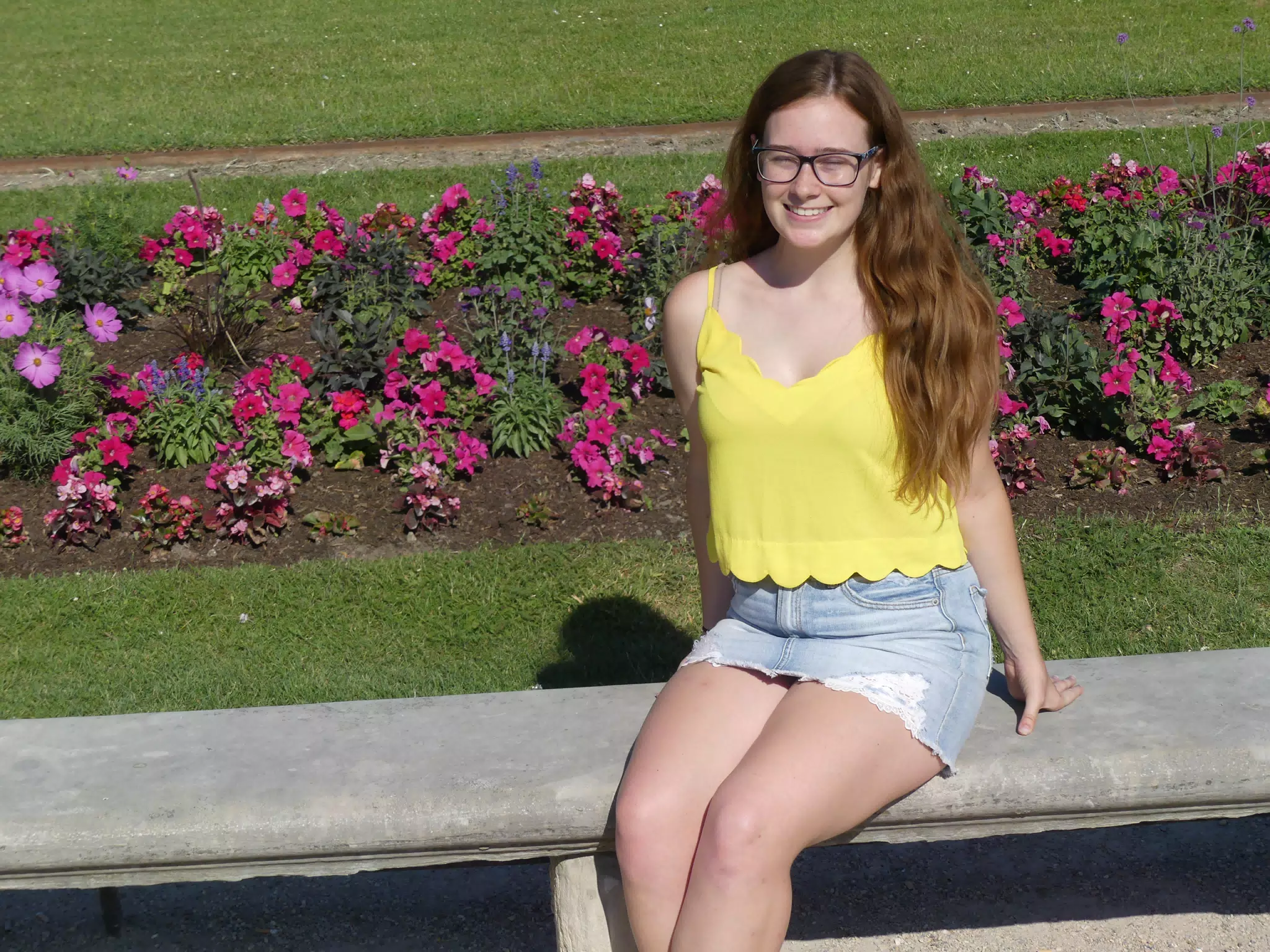 Girl in Jean Skirt on Park Bench