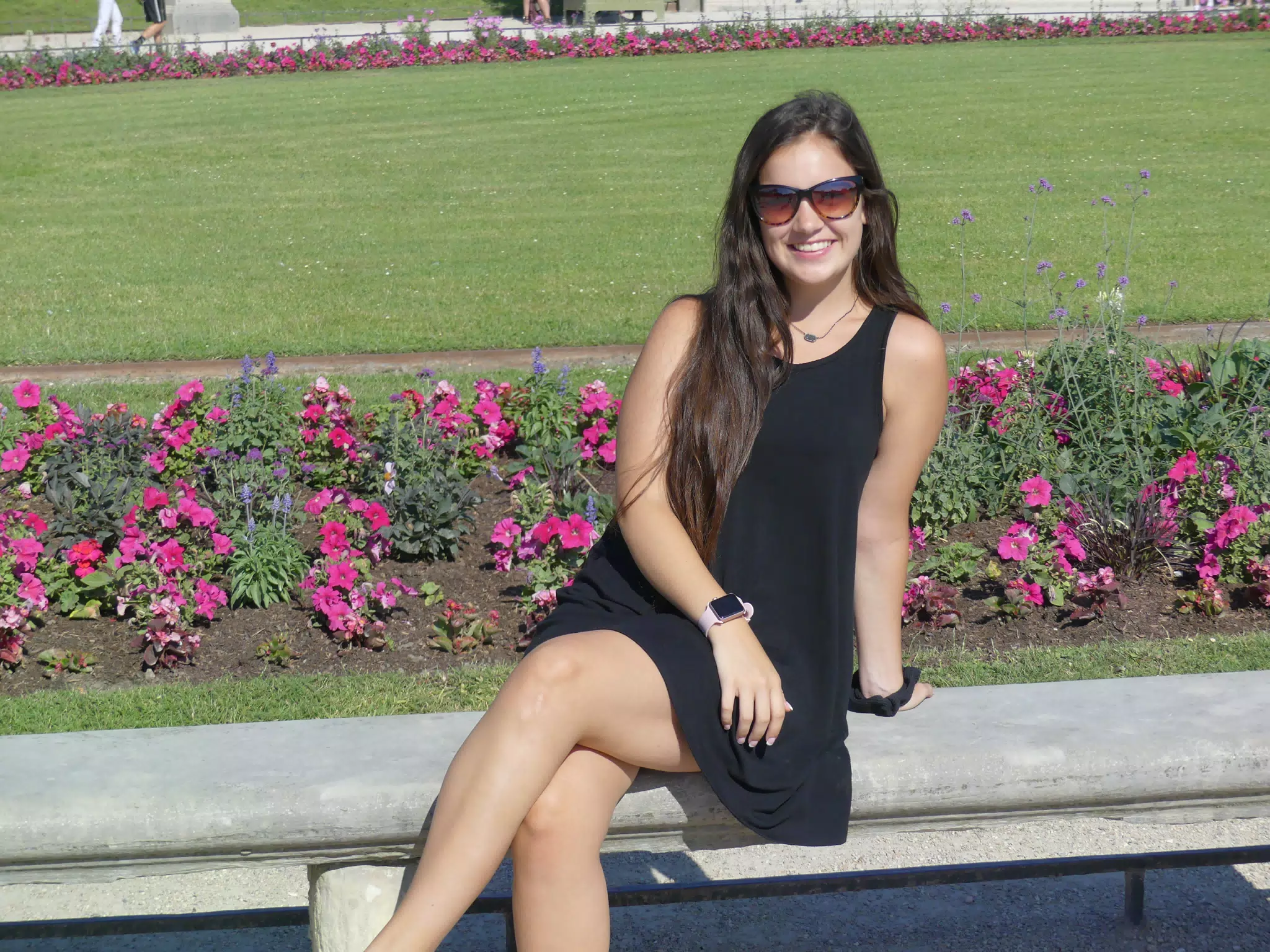 Emily in Black Dress on Park Bench in Paris