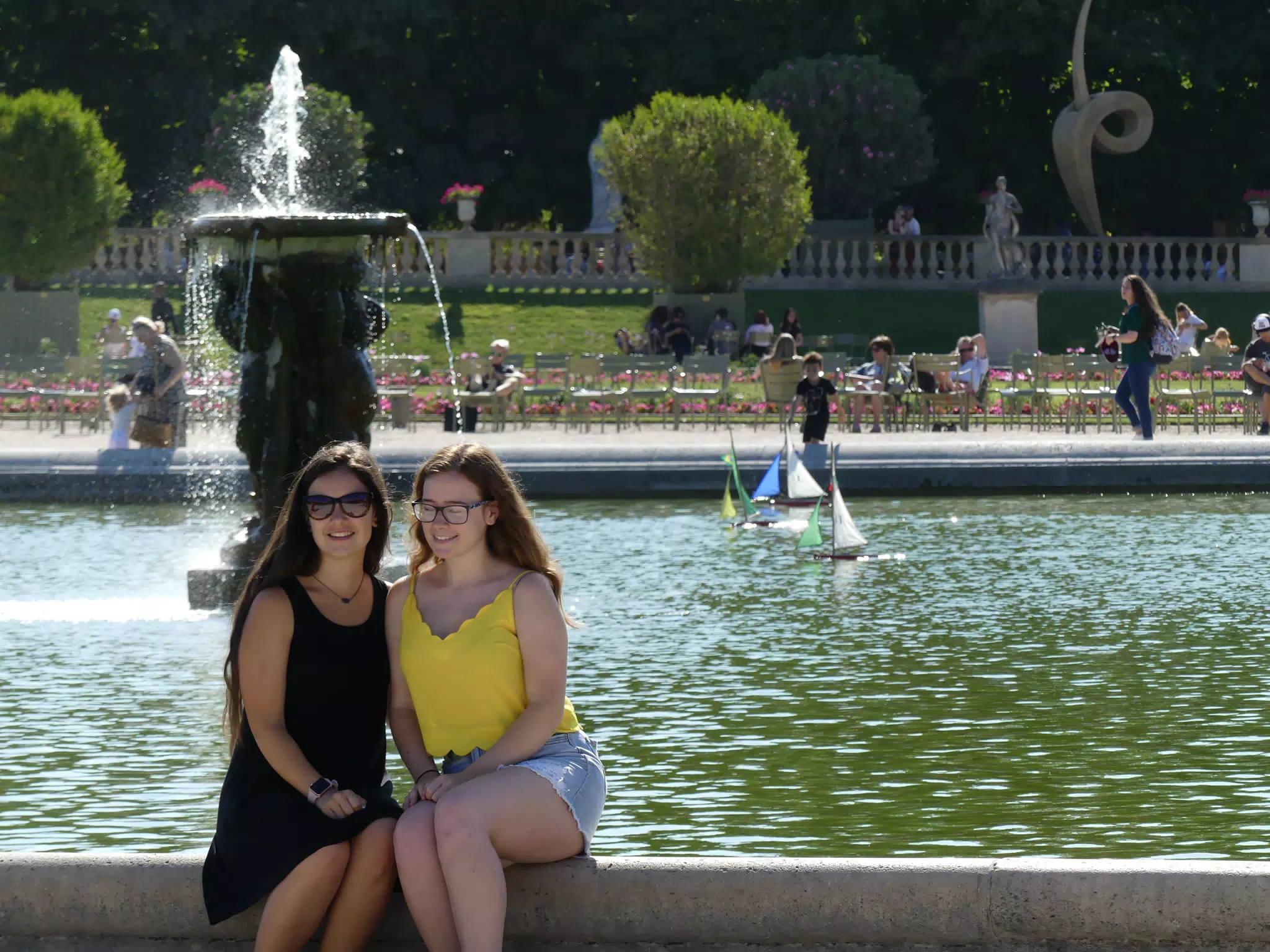 Teen Sisters by Fountain at Park in Paris