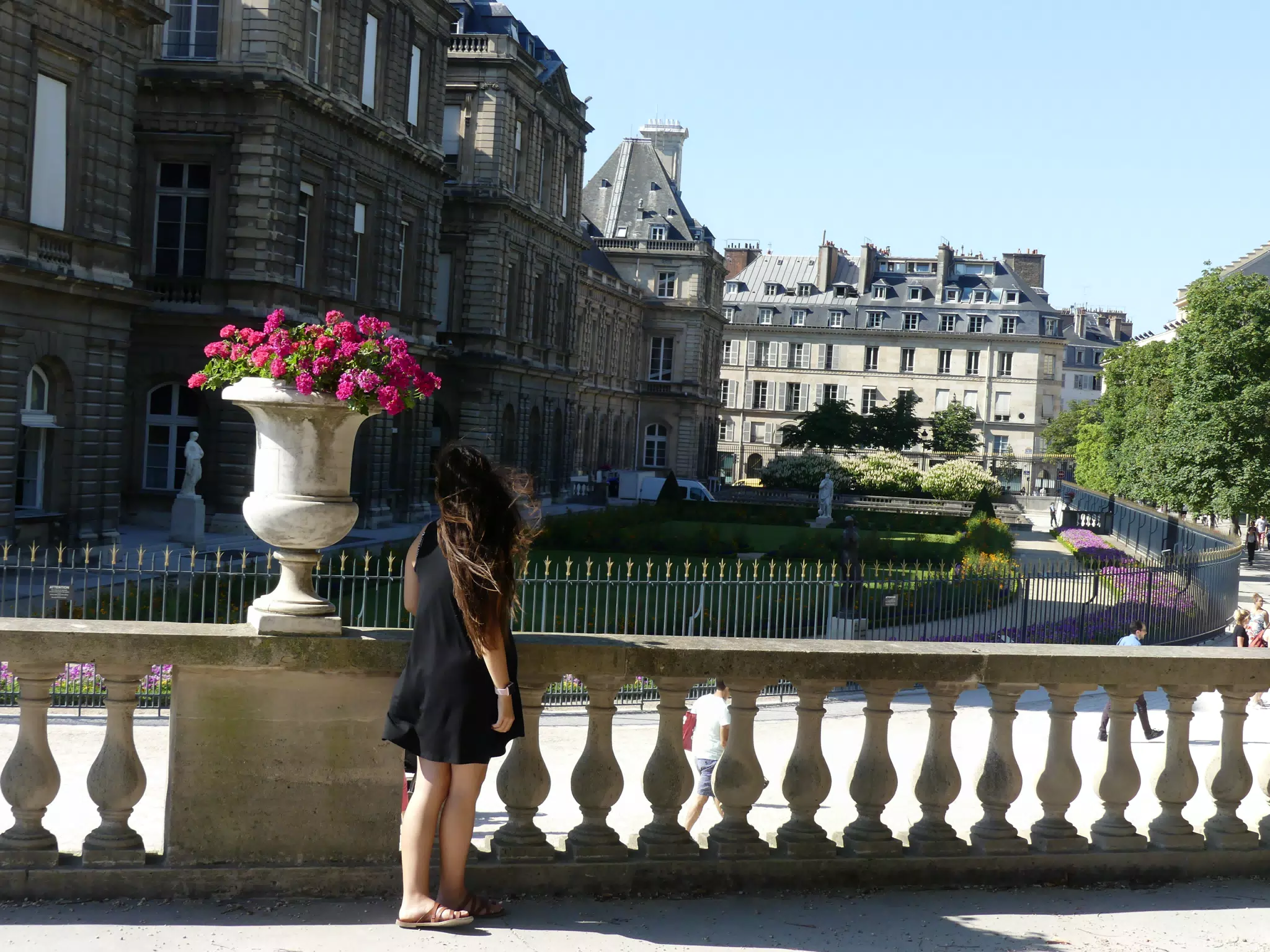 Emily in Black Dress by Wall in Paris