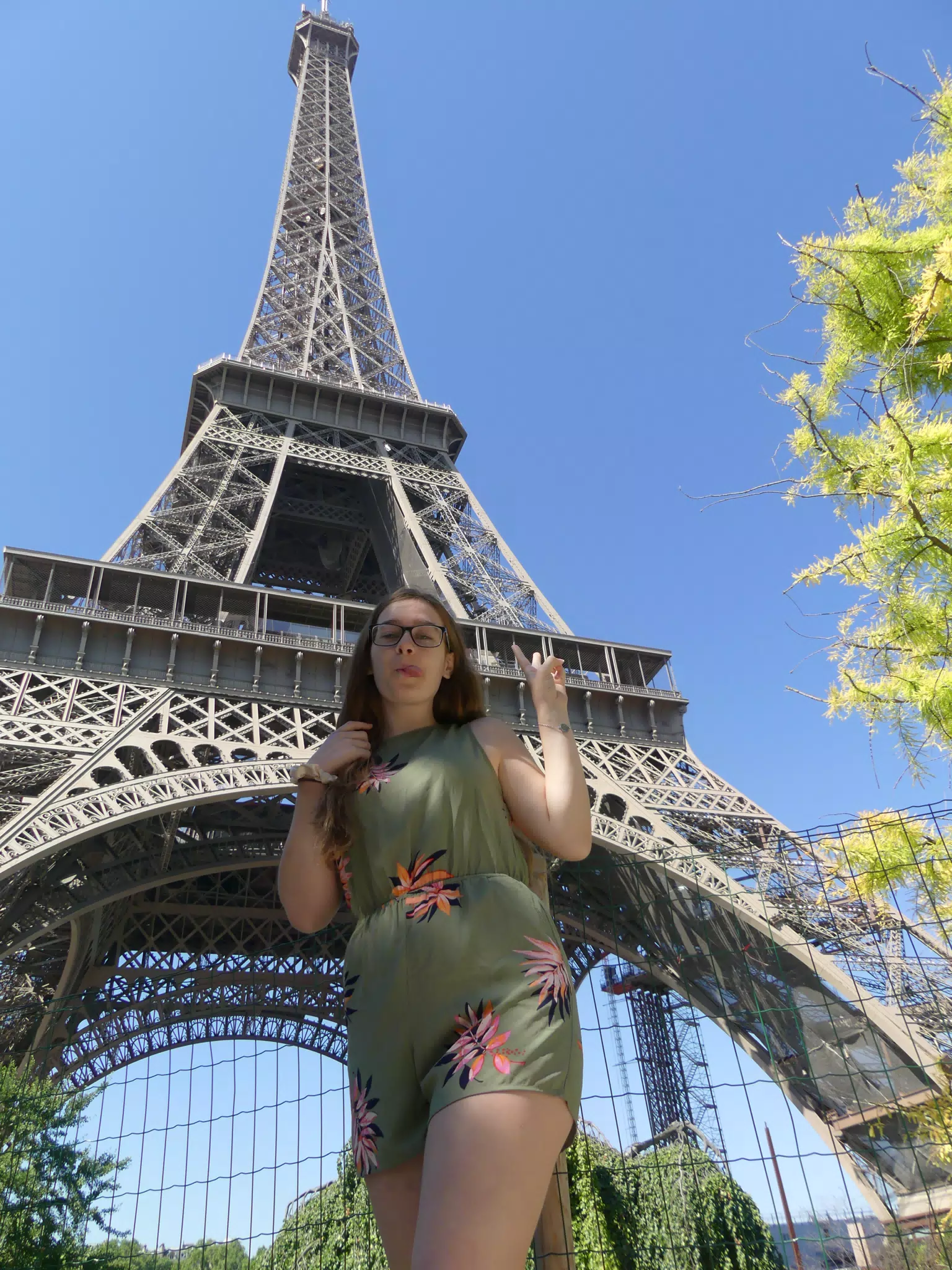 Madeline with Tongue Out at the Eiffel Tower in Romper
