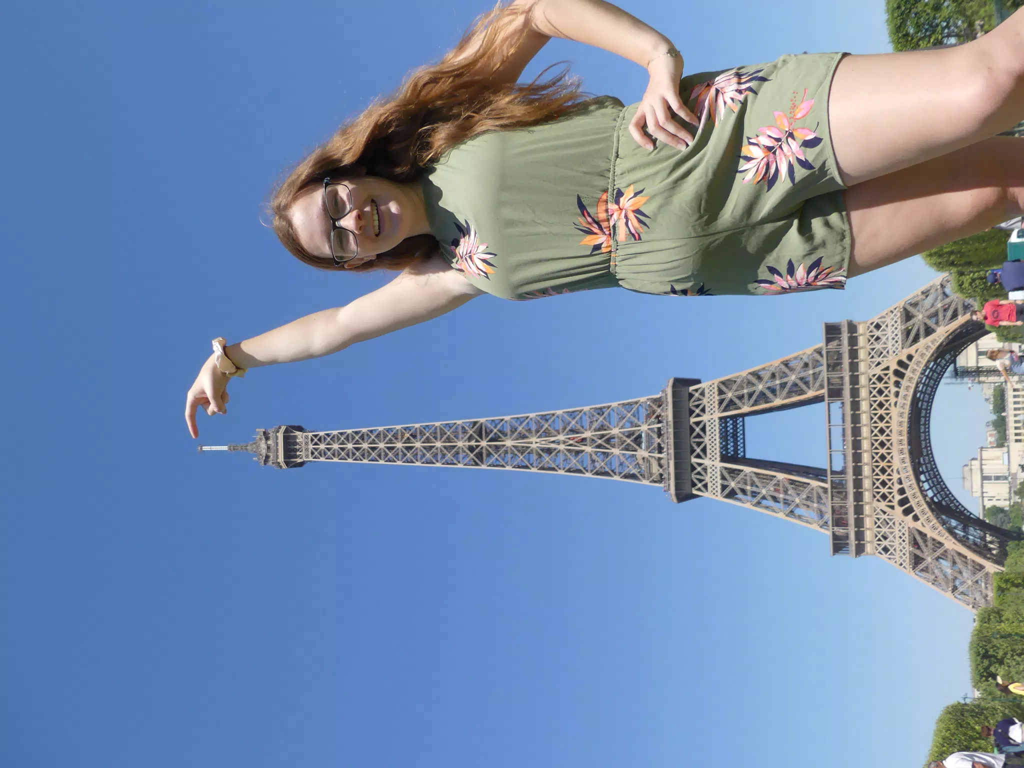 Madeline Pointing to the Eiffel Tower