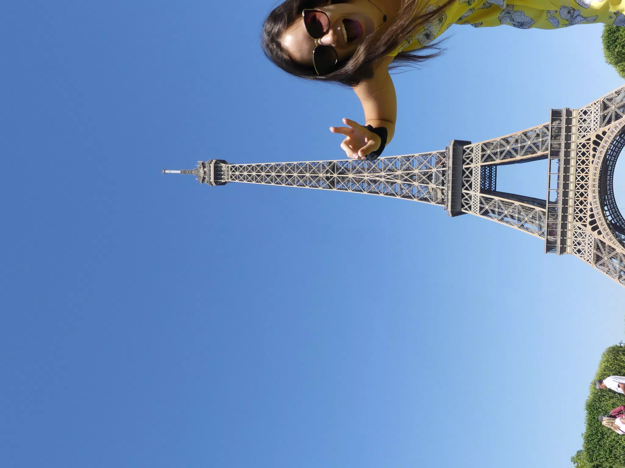 Emily Trying to Model at the Eiffel Tower
