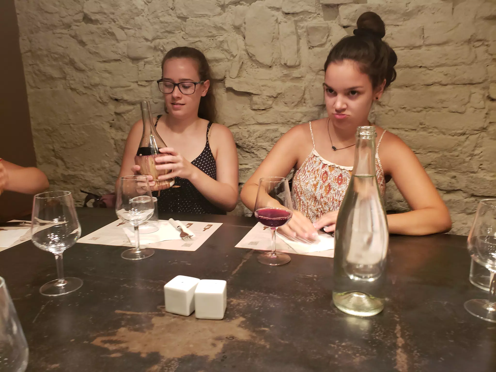 Madeline Inspecting the Wine at Dinner