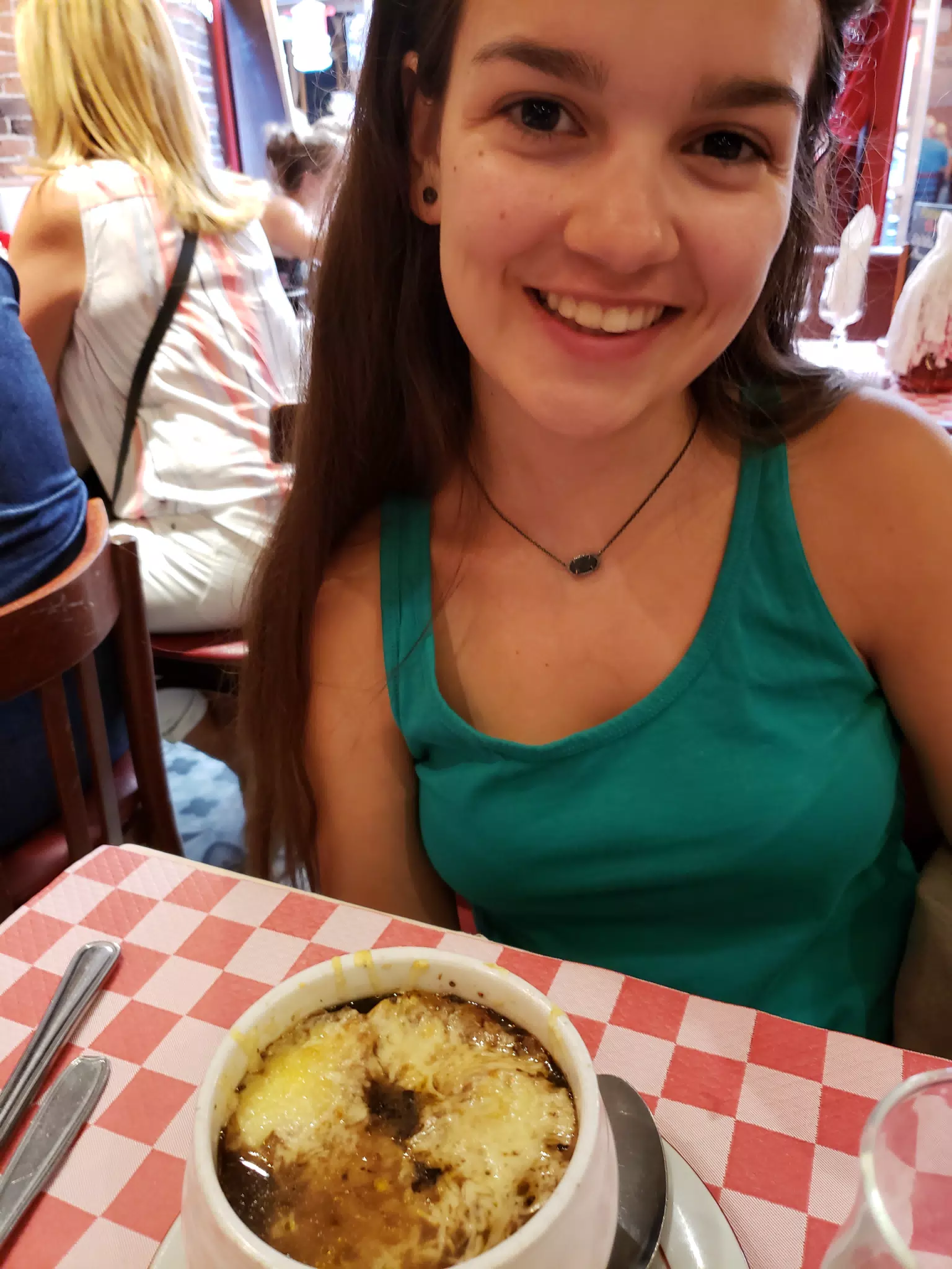 Emily with French Onion Soup in Paris