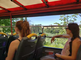 Madeline & Emily Riding Tour Bus in Florence, Italy