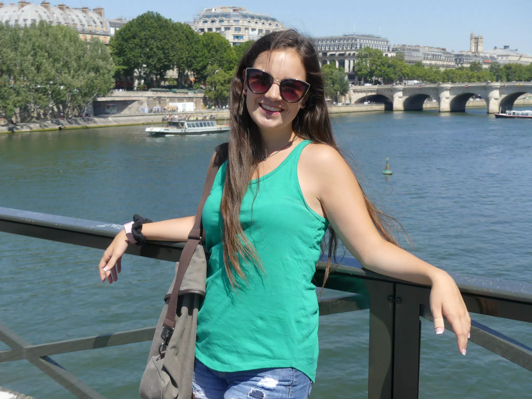 Emily Leaning on Bridge Railing