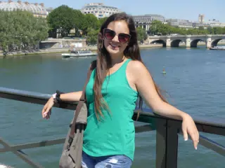 Emily Leaning on Bridge Railing