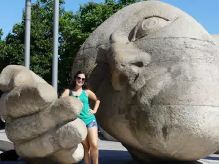 Teen Brunette Posing with Statue in Paris