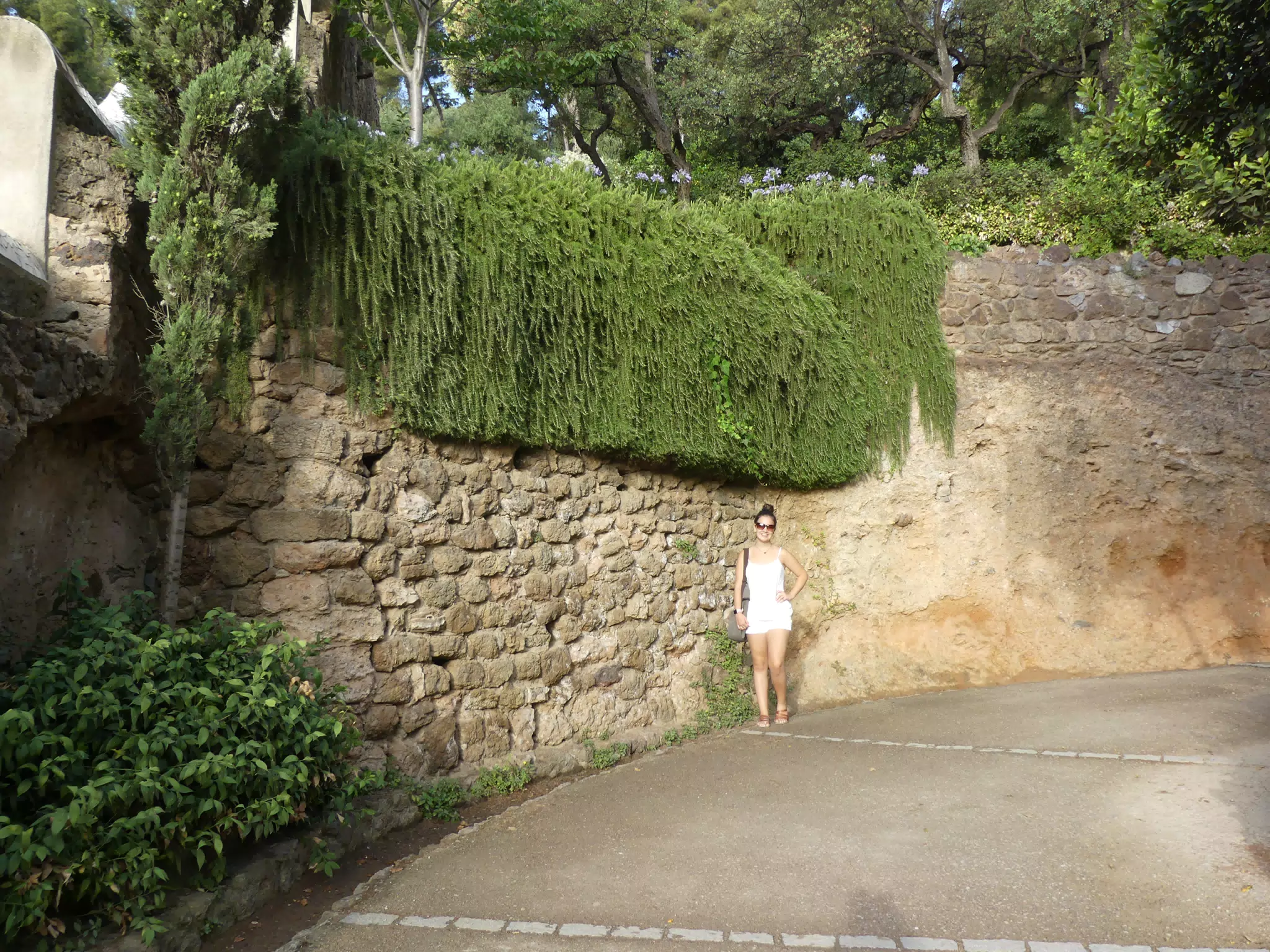 Teen Emily in All White in Park Guell in Barcelona
