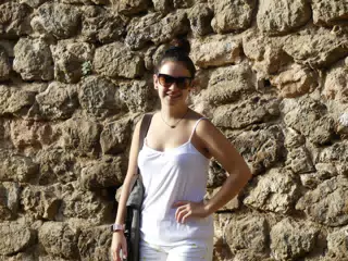 Emily in White by Stone Wall