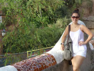 Emily in White by Railing in Park Guell