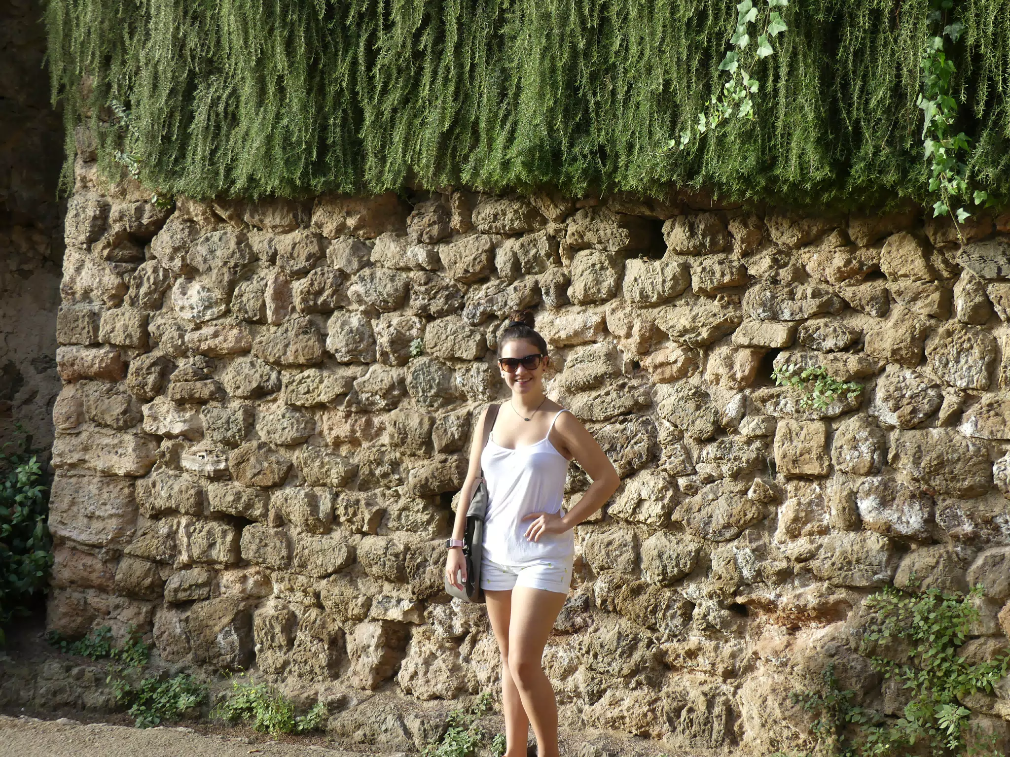 Teen Model in White by Stone Wall in Barcelona