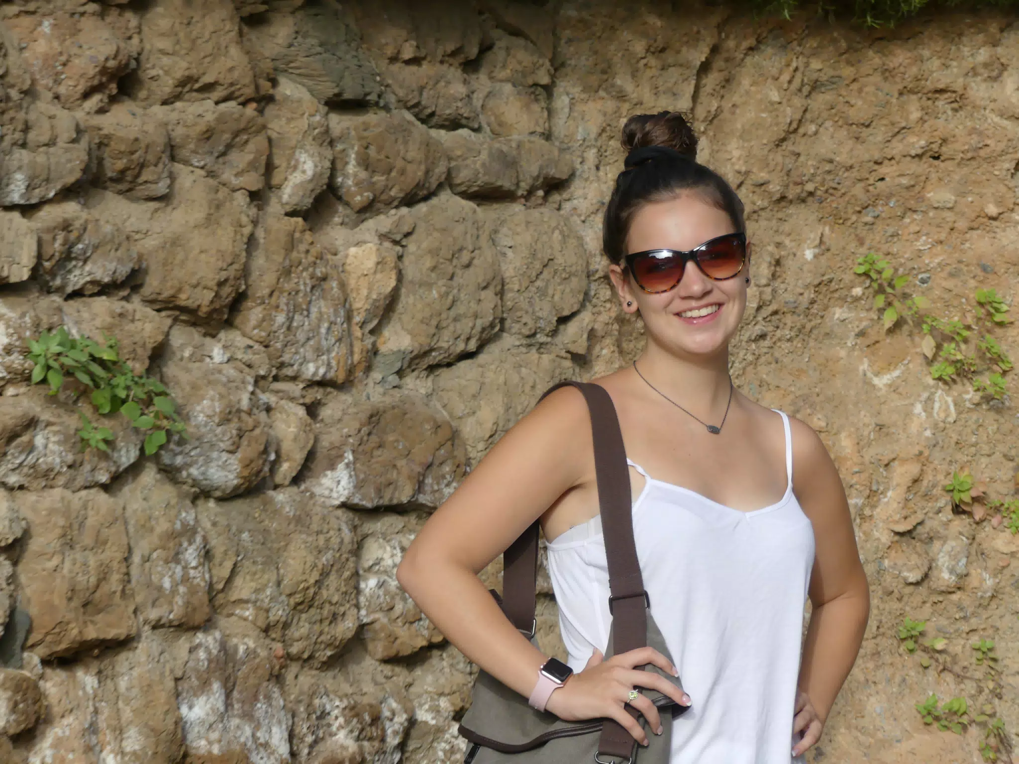 Emily Posing in White by Stone Wall