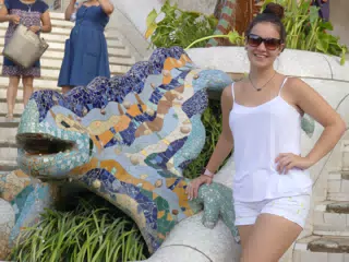 Emily in White by the Gecko at Park Guell in Barcelona
