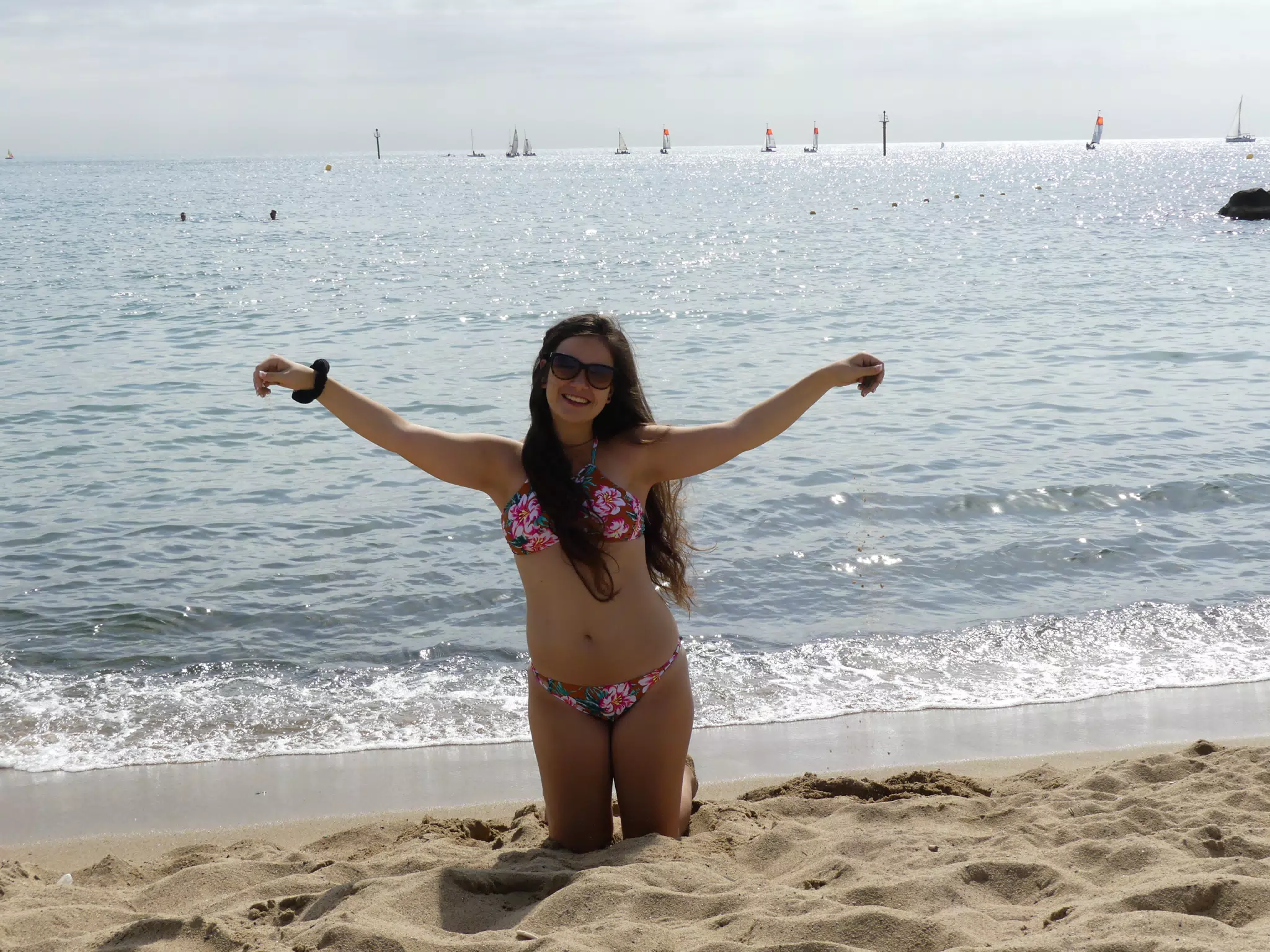 Model Kneeling in Sand in Barcelona