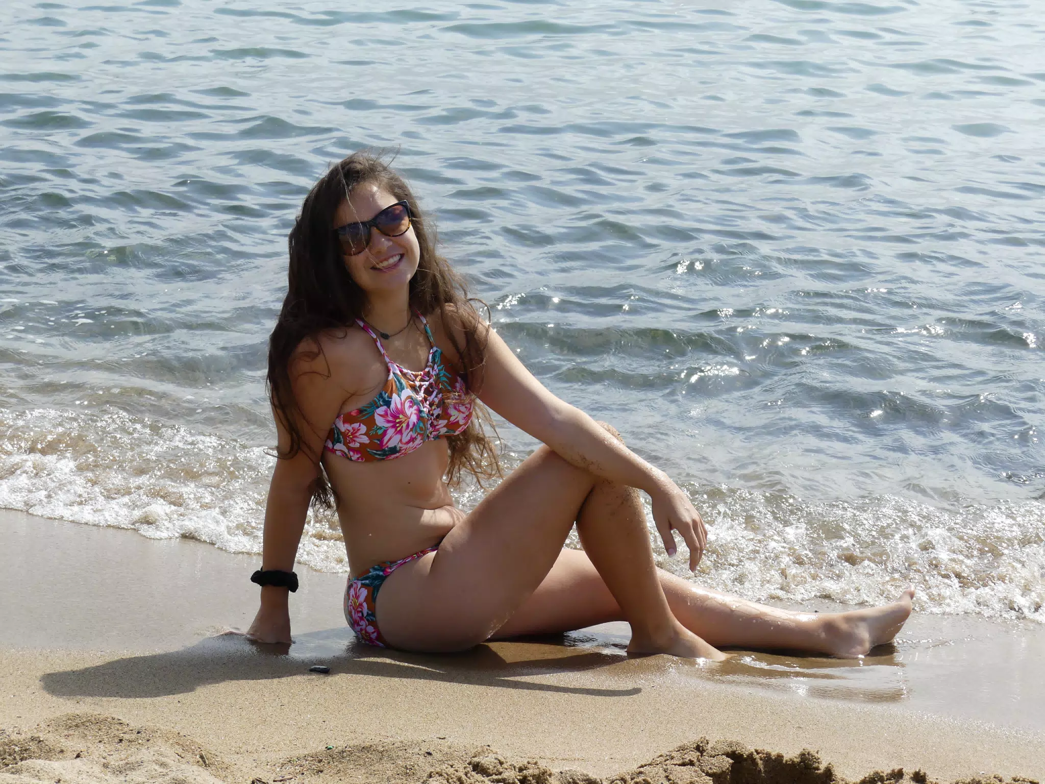 Emily Sitting on Barcelona Beach in Bathing Suit