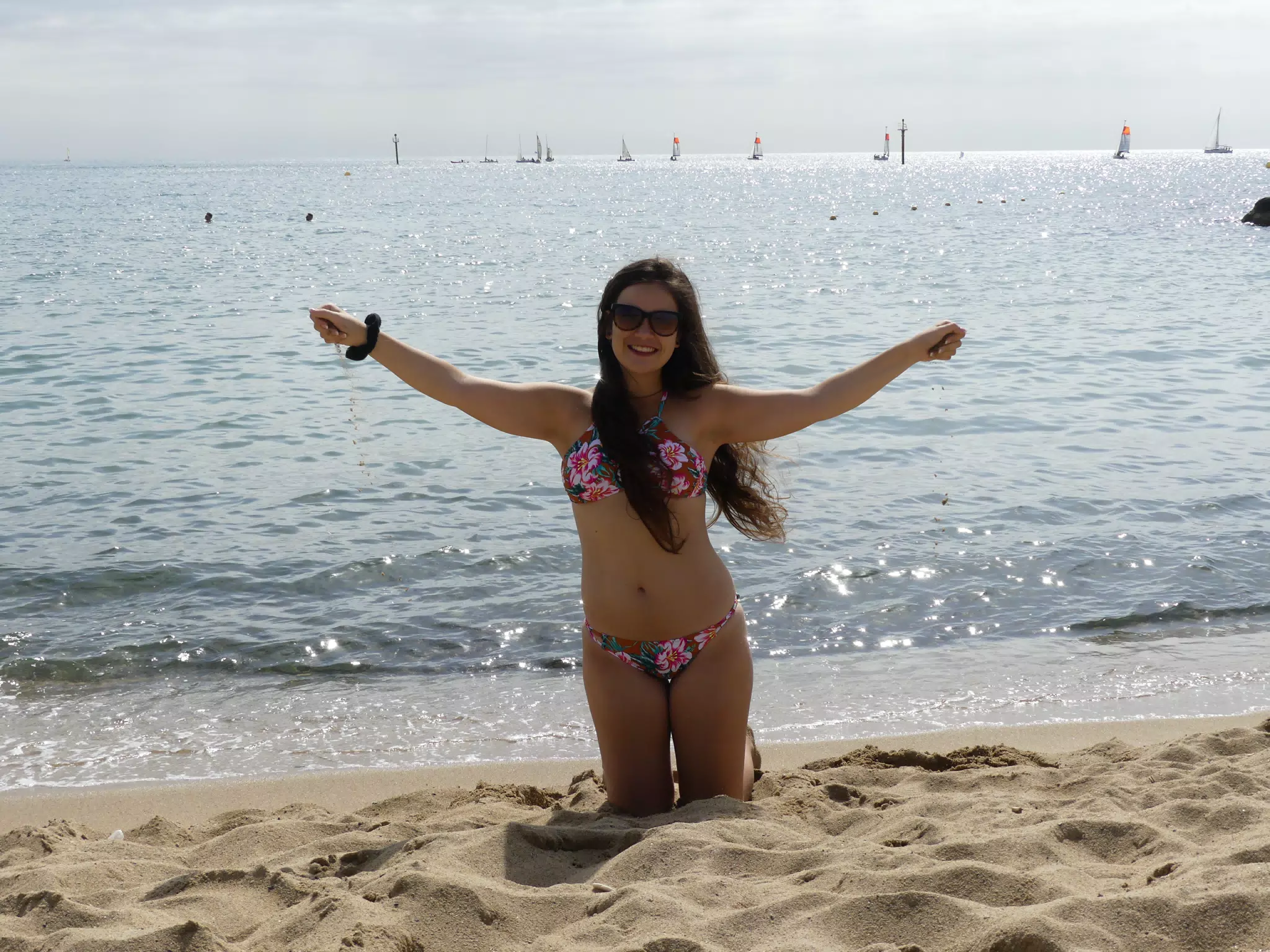 Girl Playing in Sand on Barcelona Beach