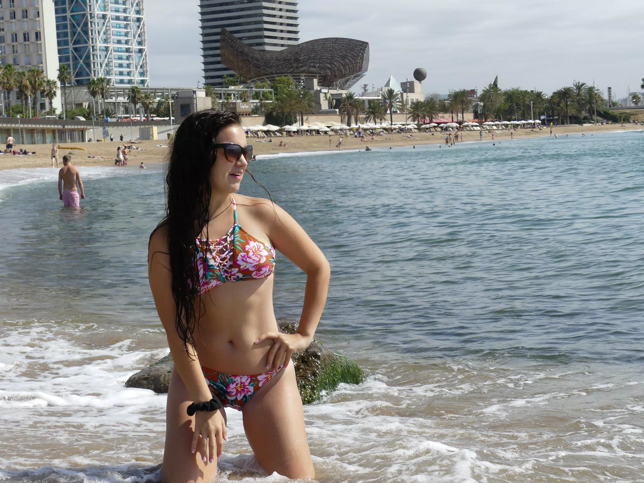 Brunette Teen Girl on Knees in Mediterranean Sea in Barcelona Spain in Bikini on Beach