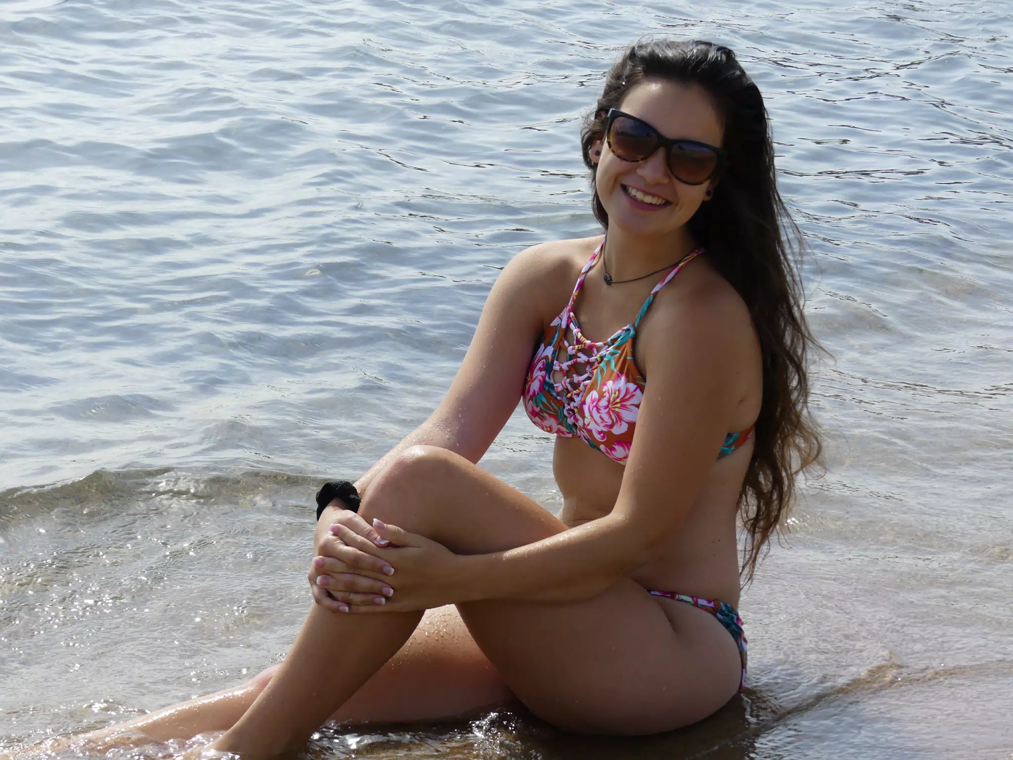 Teen Model Holding Knee in Sand in Barcelona Beach