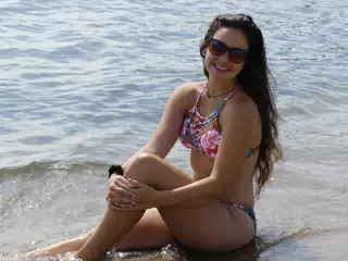 Teen Model Holding Knee in Sand in Barcelona Beach