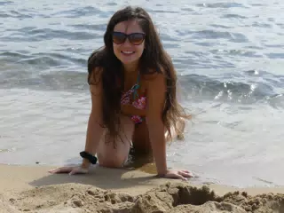Swimsuit Model Crawling on Beach in Barcelona