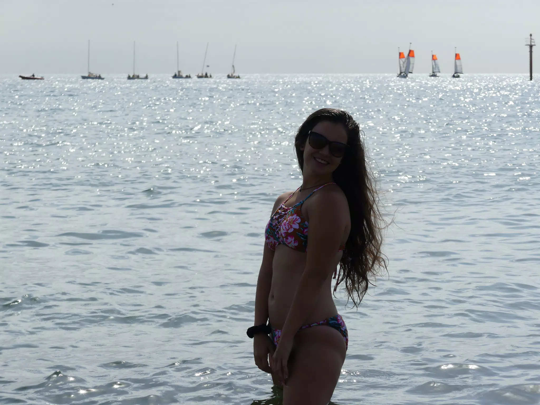 Brunette Silouhette in Front of Glistening Sea