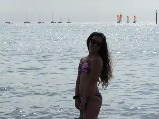 Brunette Silouhette in Front of Glistening Sea