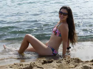 Model on Beach in Barcelona Reclining in Sand