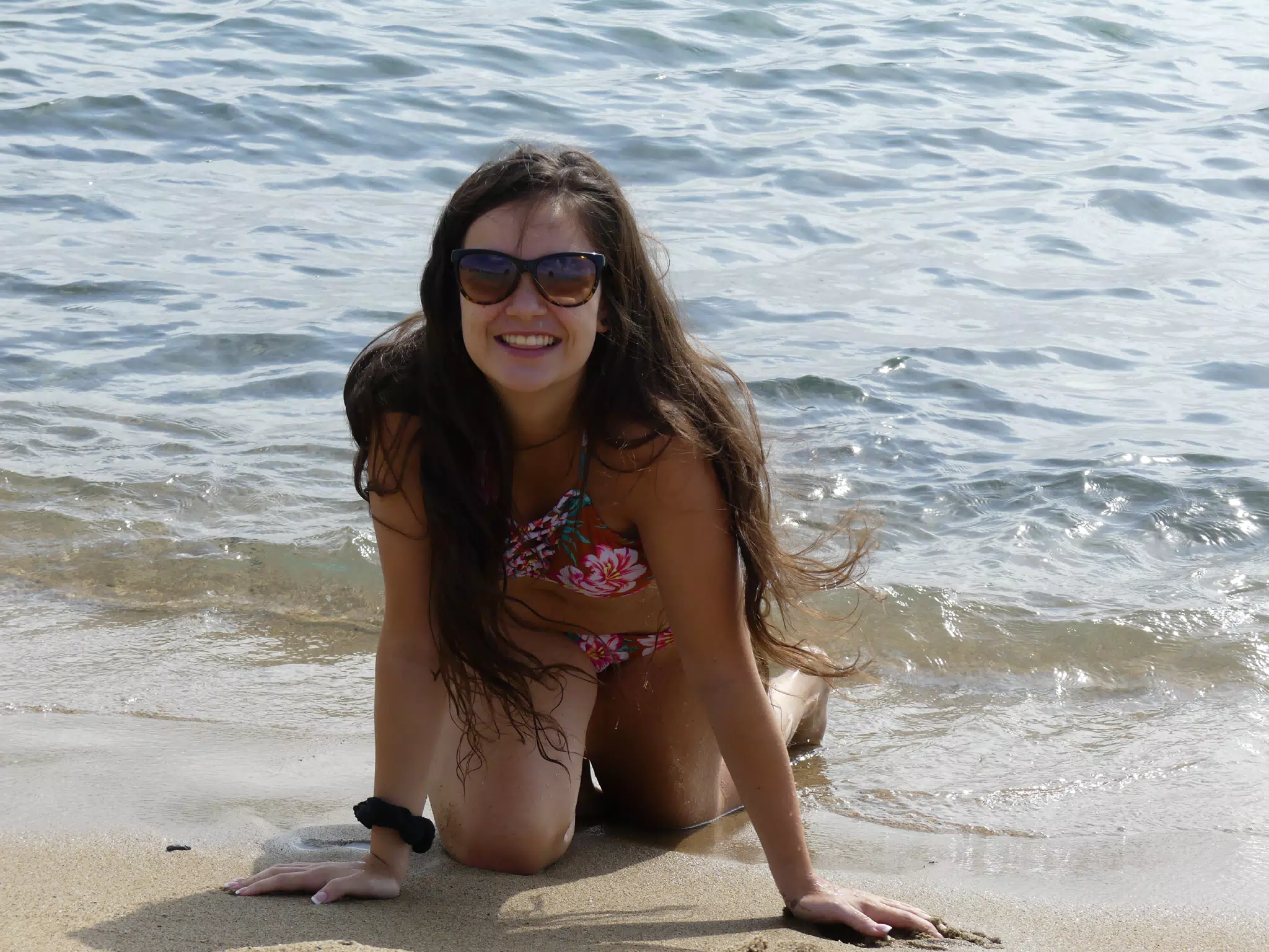 Brunette Crawling on Beach in Barcelona