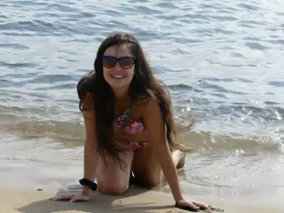 Brunette Crawling on Beach in Barcelona