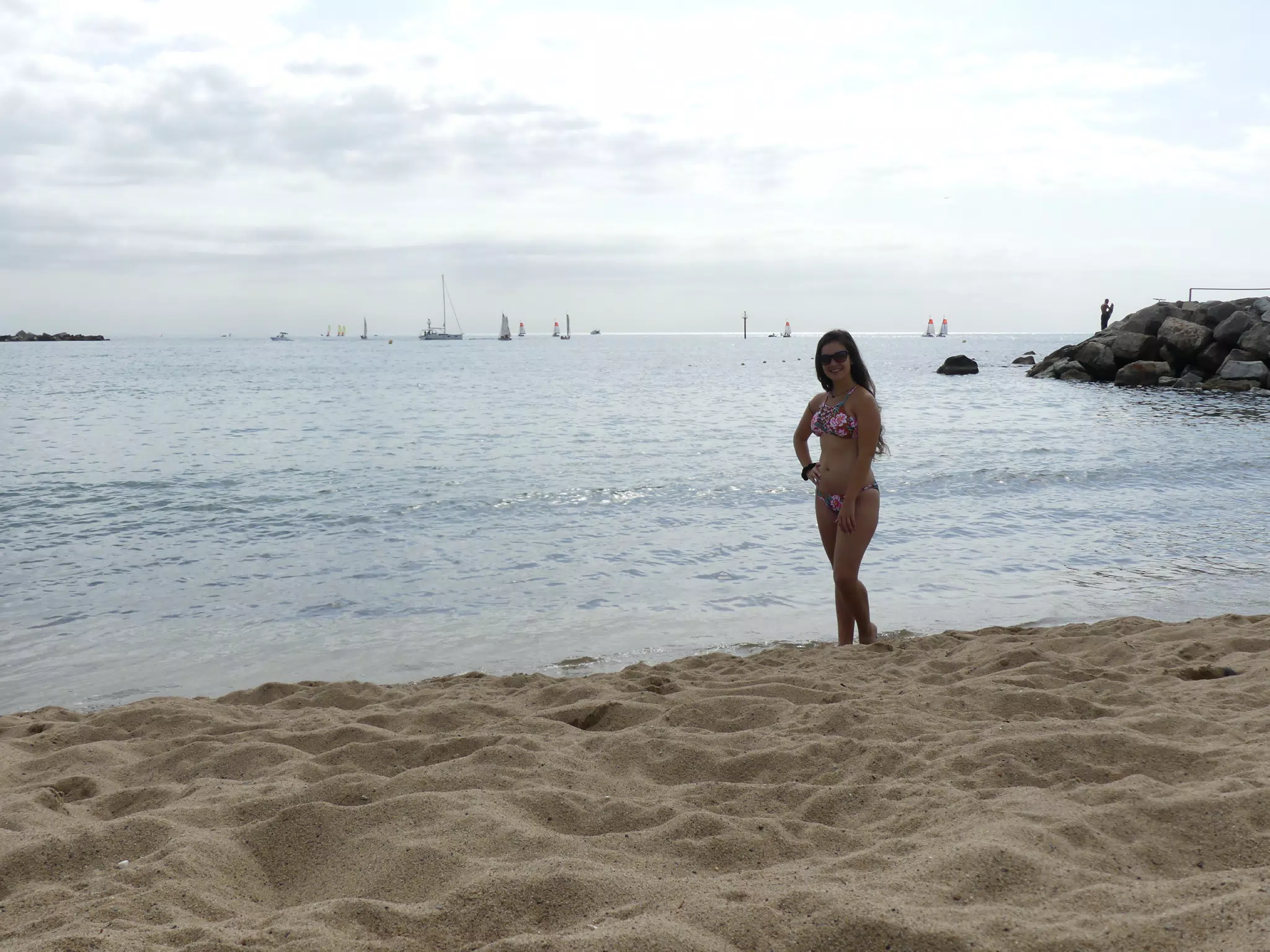 Emily Posing on Barcelona Beach, Brunette in Swimsuit