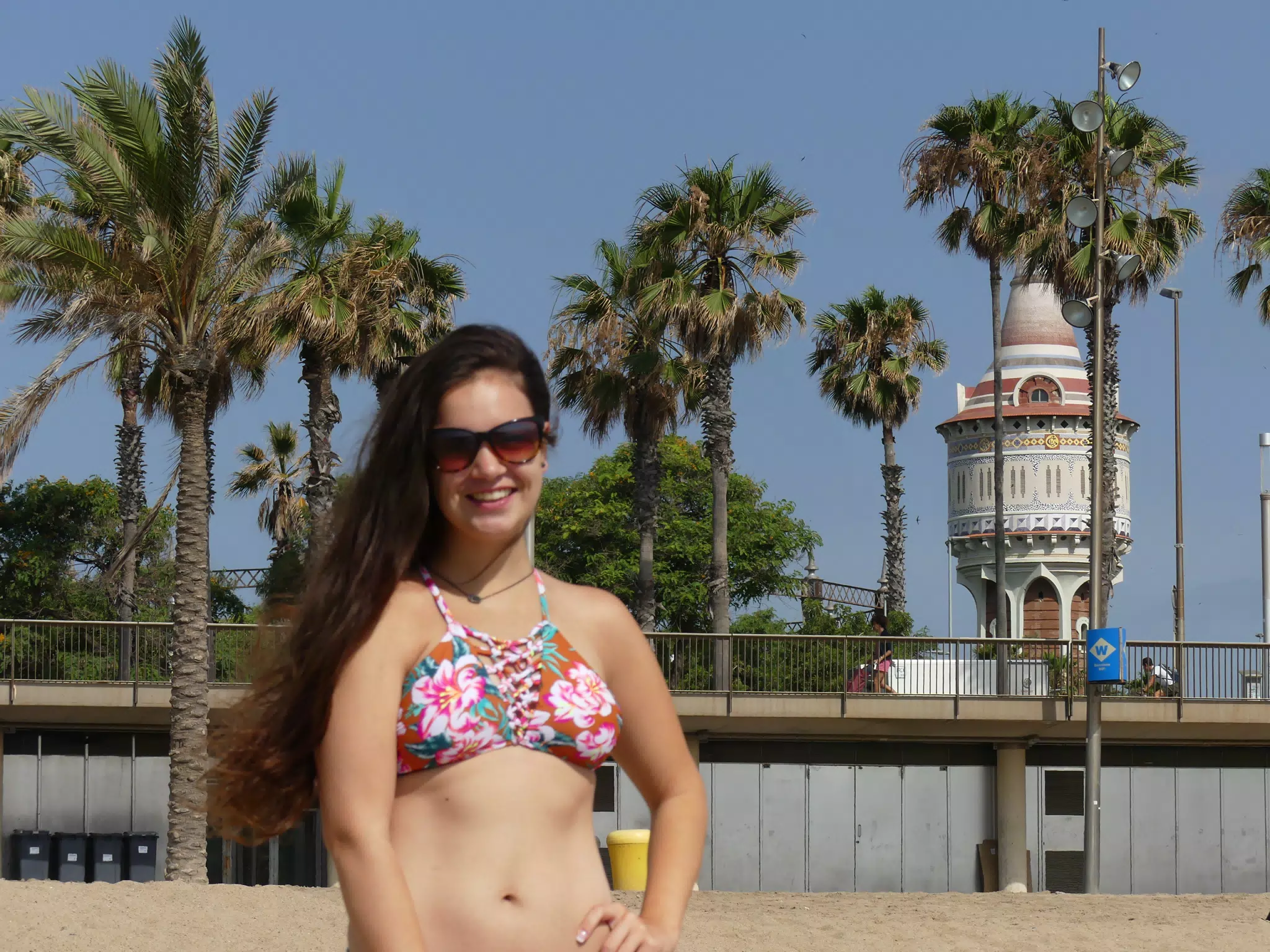 Girl by Tower on Barcelona Beach