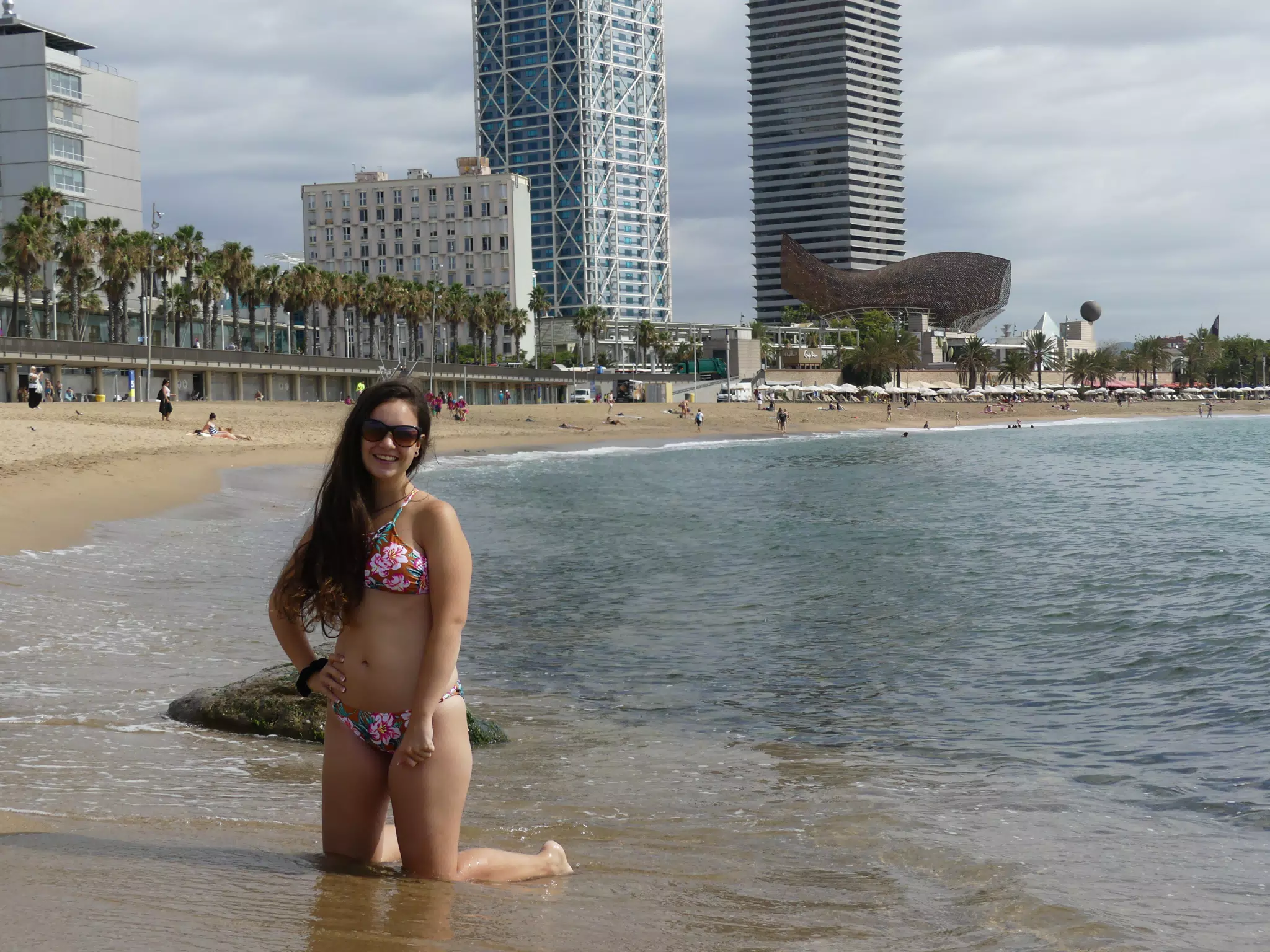 Emily on Knees on Beach in Barcelona