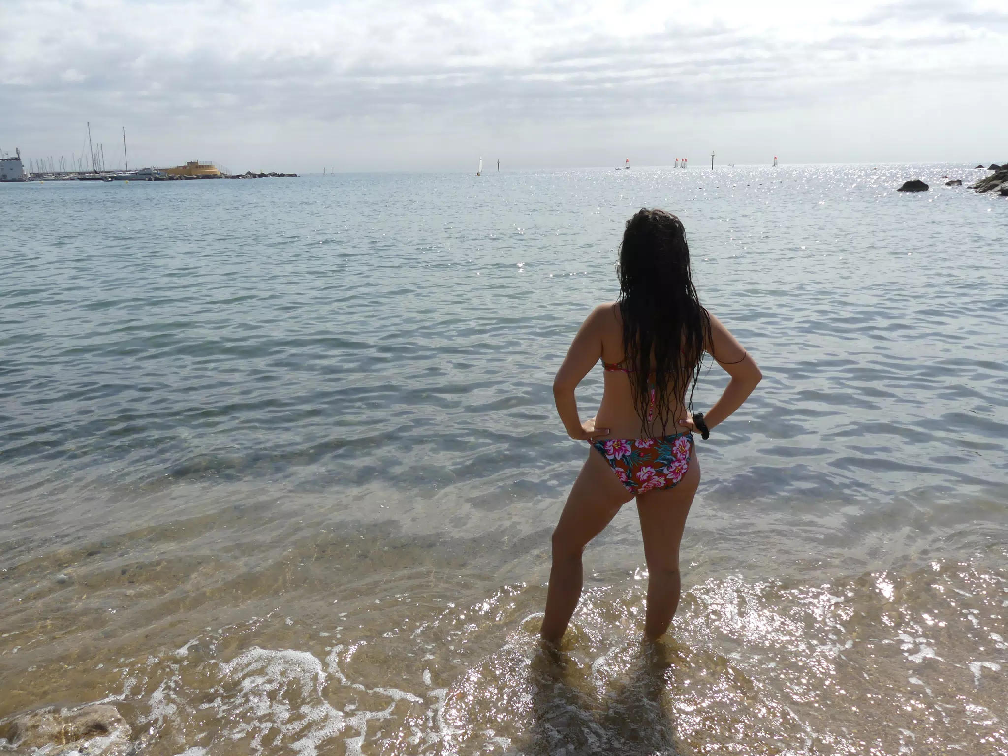 Girl in Bikini Looking Out to Sea in Barcelona