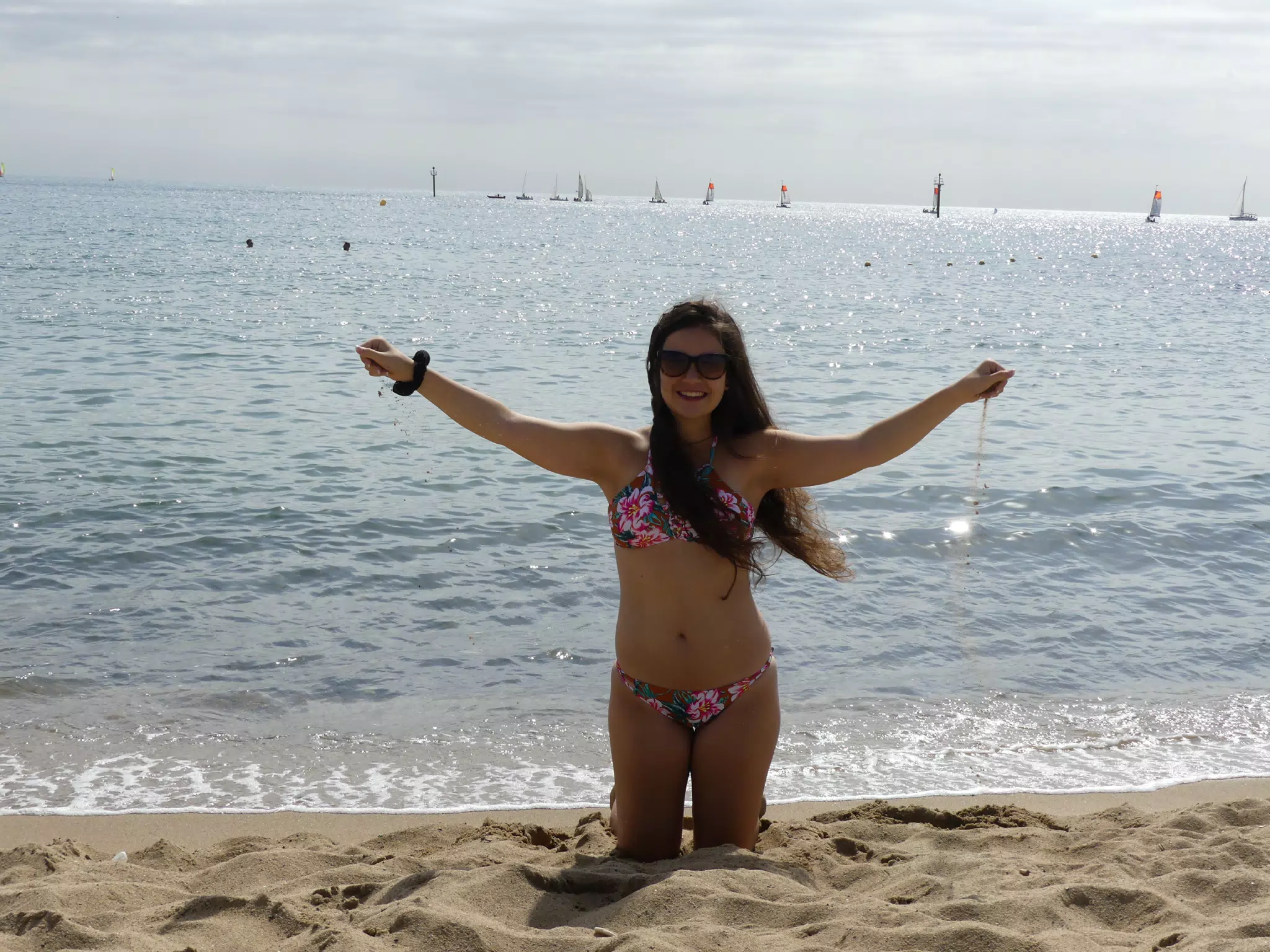 Brunette on Knees on Barcelona Beach in Sand