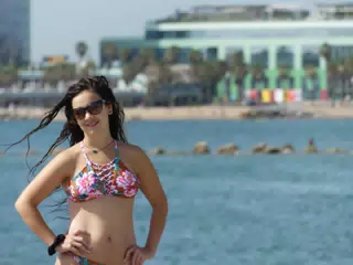 Girl in Bikini Posing on Beach in Barcelona