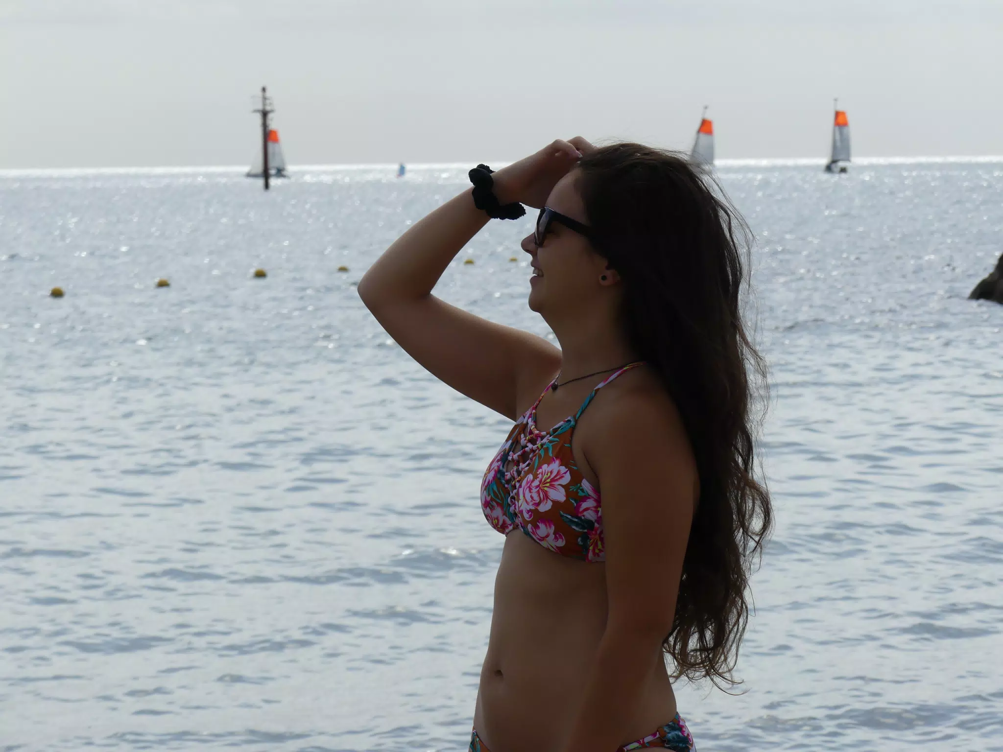 Teen Bikini Model Fixing Hair on Barcelona Beach in Swimsuit