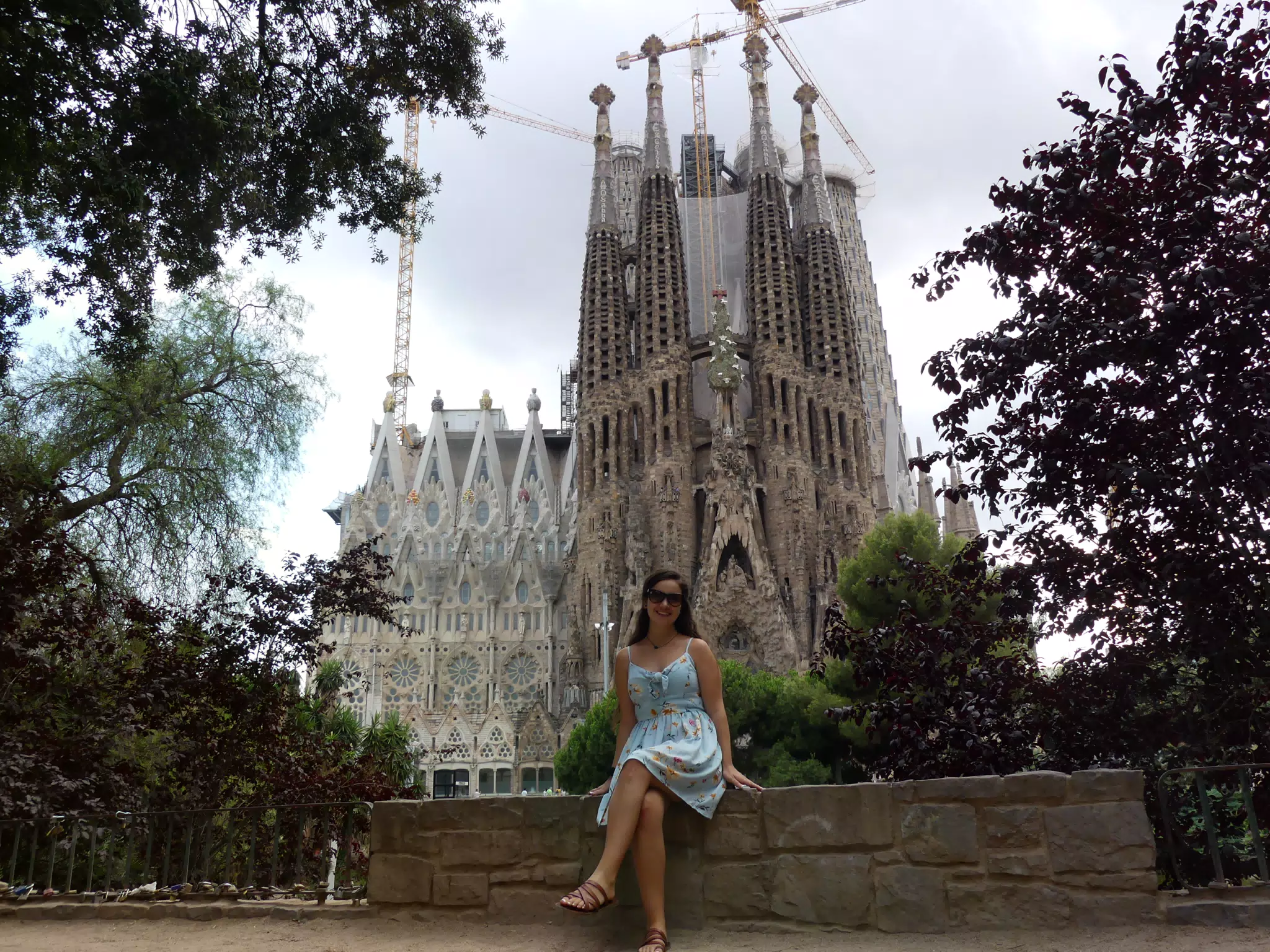 Emily at the Sagrada Familia in Barcelona in Dress and Sandals